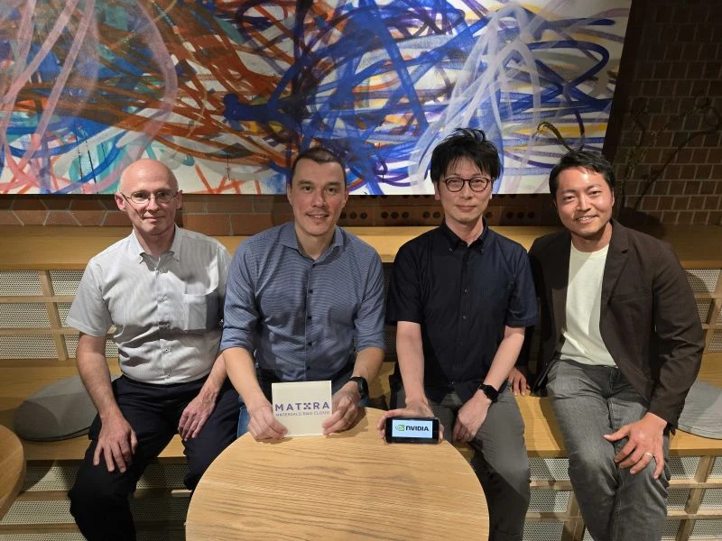Meeting with colleagues in Japan, with Mat3ra and NVIDIA signs on the table